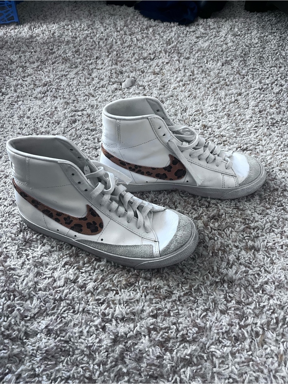 Nike White High-Top Sneakers with Leopard Swoosh